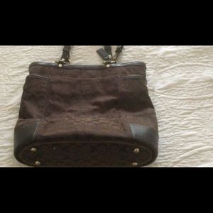 Vintage Coach Color Chocolate Purple lining.  Slight discoloration one side top.